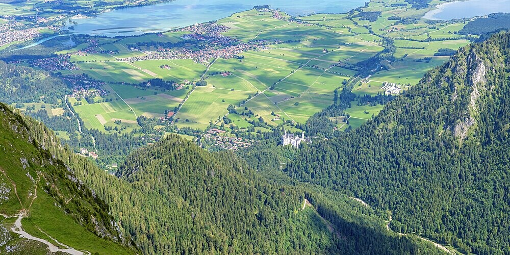 Panorama from the Säuling, 2047m, to Neuschwanstein Castle, Füssen, Schwangau, Sankt Coloman and the Forggensee, Ostallgäu, Bavaria, Germany