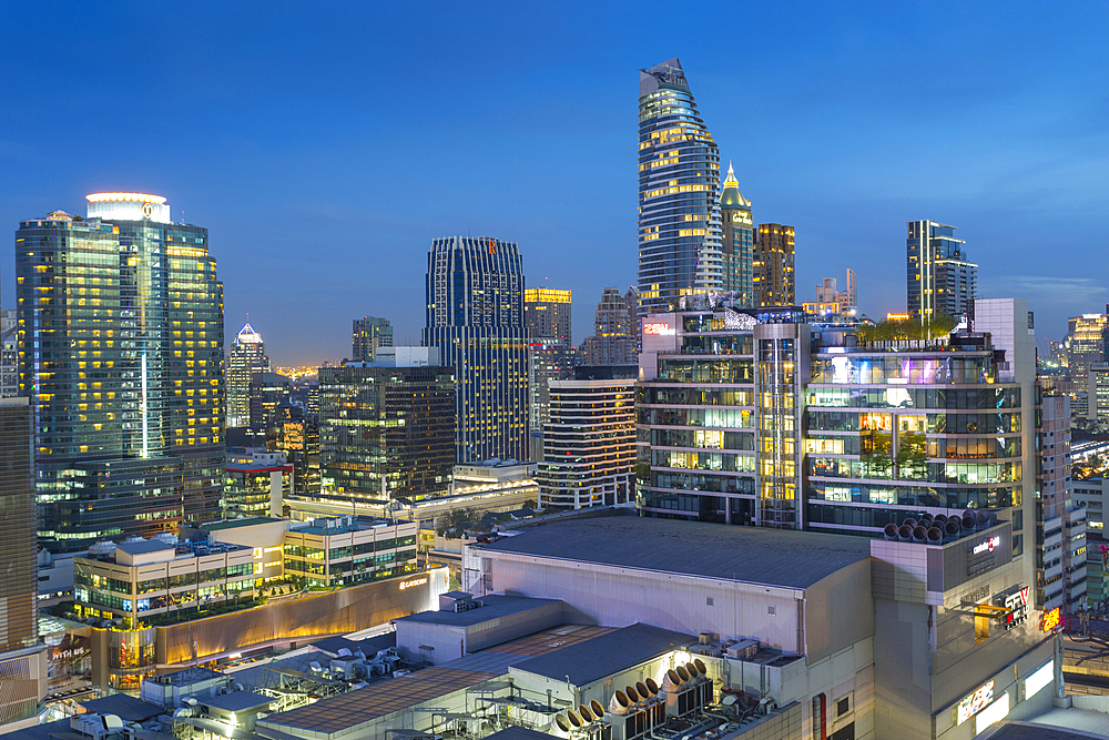 City skyline at dusk from hotel rooftop bar, Bangkok, Thailand, Southeast Asia, Asia