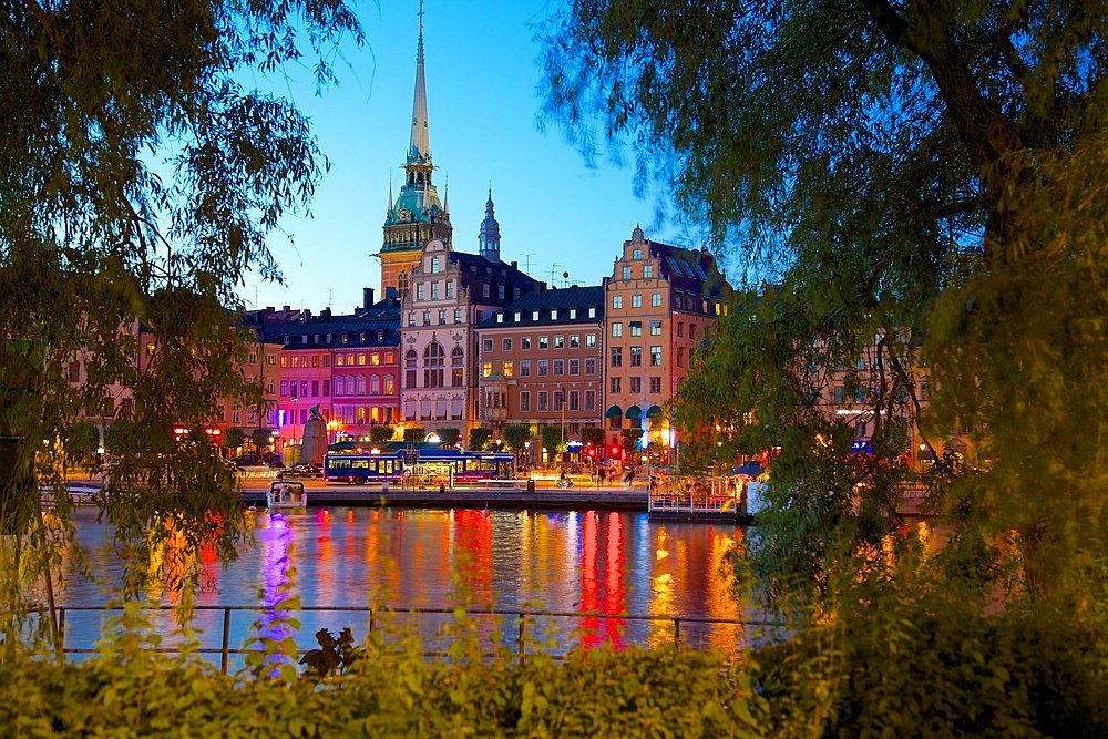 Gamla Stan and Riddarholmen with spire of Riddarholmskyrkan (Riddarholmen Church) at dusk, Stockholm, Sweden, Scandinavia, Europe