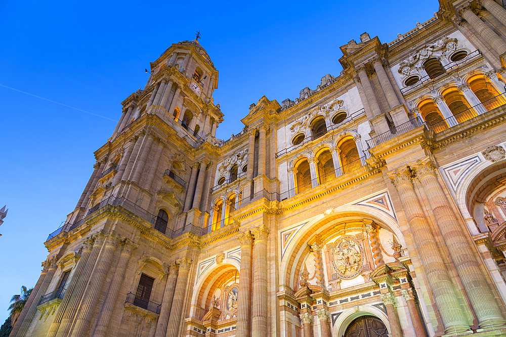 View of Cathedral in Plaza del Obispo at dusk, Malaga, Costa del Sol, Andalusia, Spain, Europe