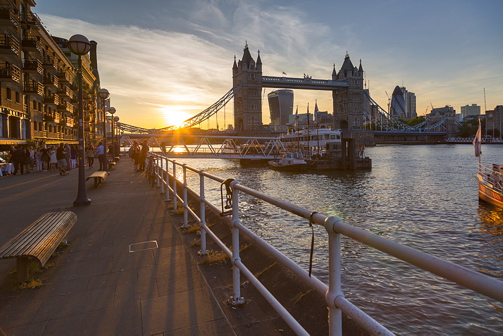 Tower Bridge and City of London skyline from Butler's Wharf at sunset, London, England, United Kingdom, Europe