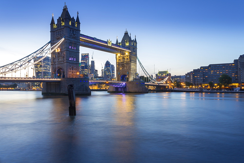 Tower Bridge and City of London skyline from Butler's Wharf at dusk, London, England, United Kingdom, Europe