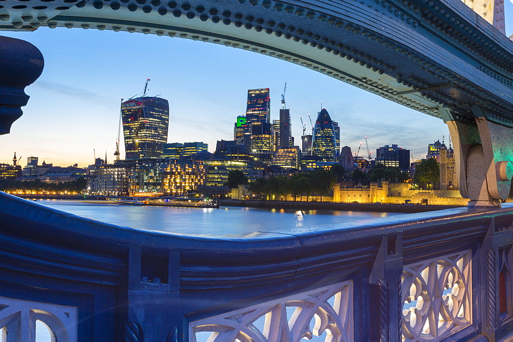 View of City of London skyline from Tower Bridge at dusk, London, England, United Kingdom, Europe