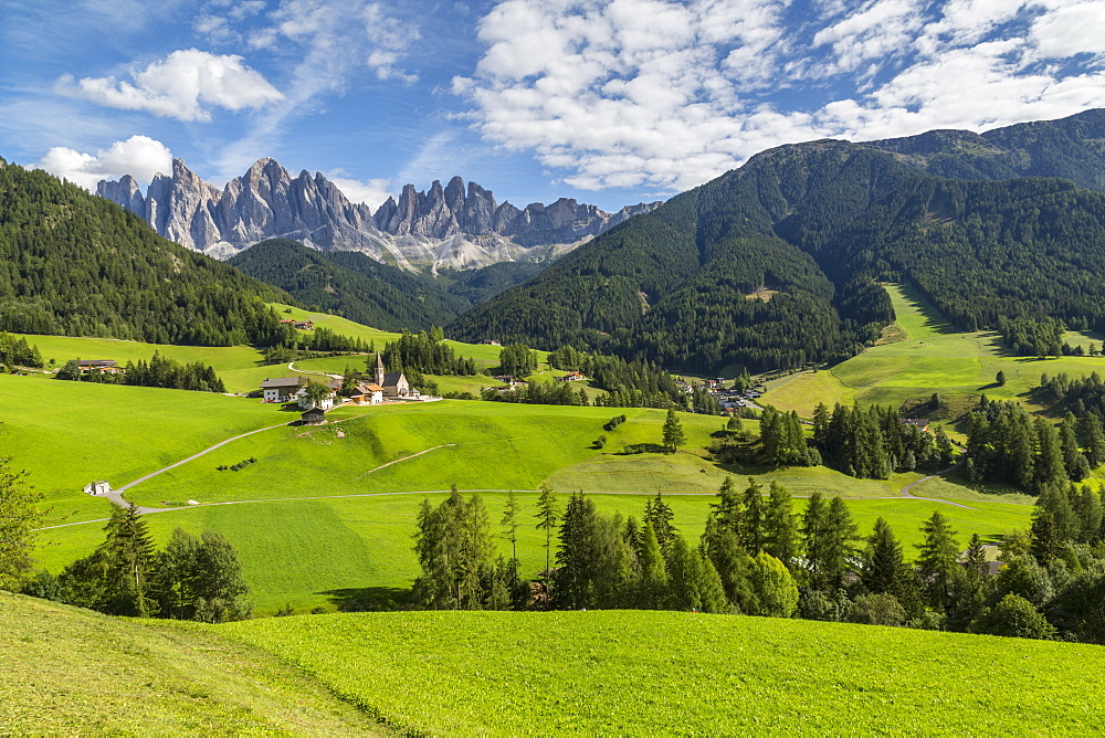 View of Church and mountain backdrop, Val di Funes, Bolzano Province, Trentino-Alto Adige/South Tyrol, Italian Dolomites, Italy, Europe