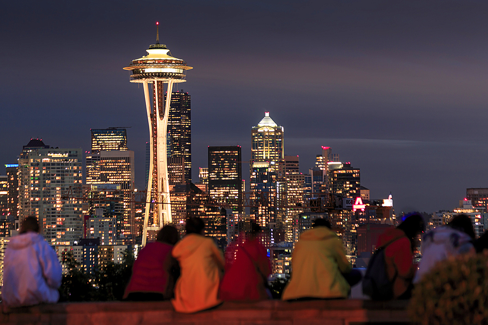 Seattle city skyline at night with illuminated office buildings and Space Needle viewed from public garden near Kerry Park, Seattle, Washington State, United States of America, North America