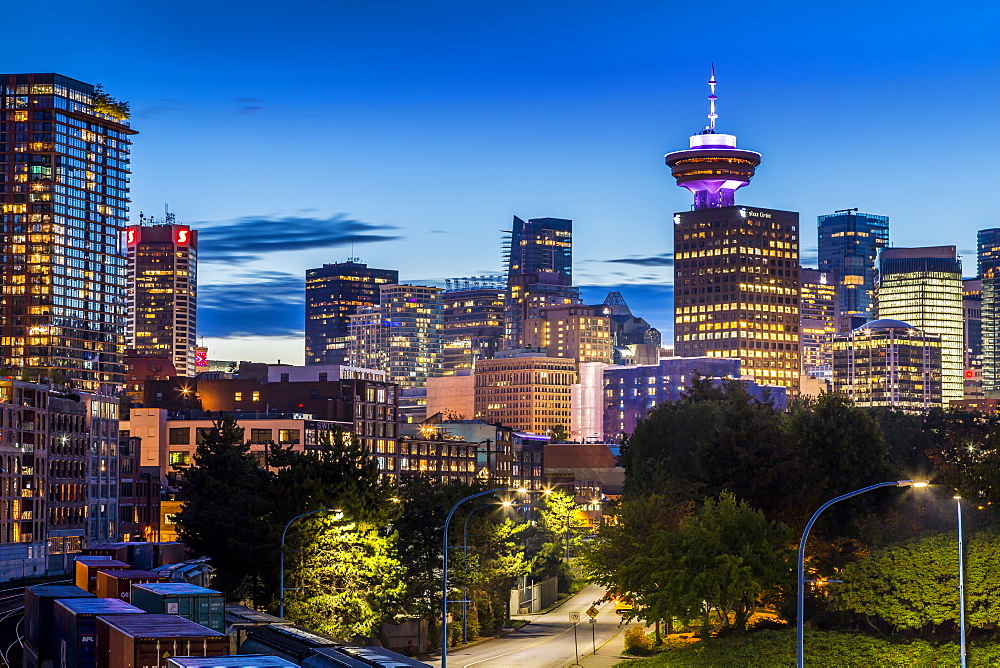 View of city skyline and Vancouver Lookout Tower at dusk from Portside, Vancouver, British Columbia, Canada, North America