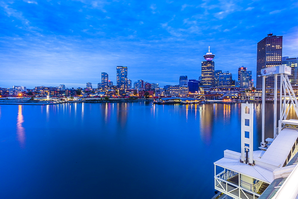 City skyline including Vancouver Lookout Tower as viewed from Canada Place at dusk, Vancouver, British Columbia, Canada, North America