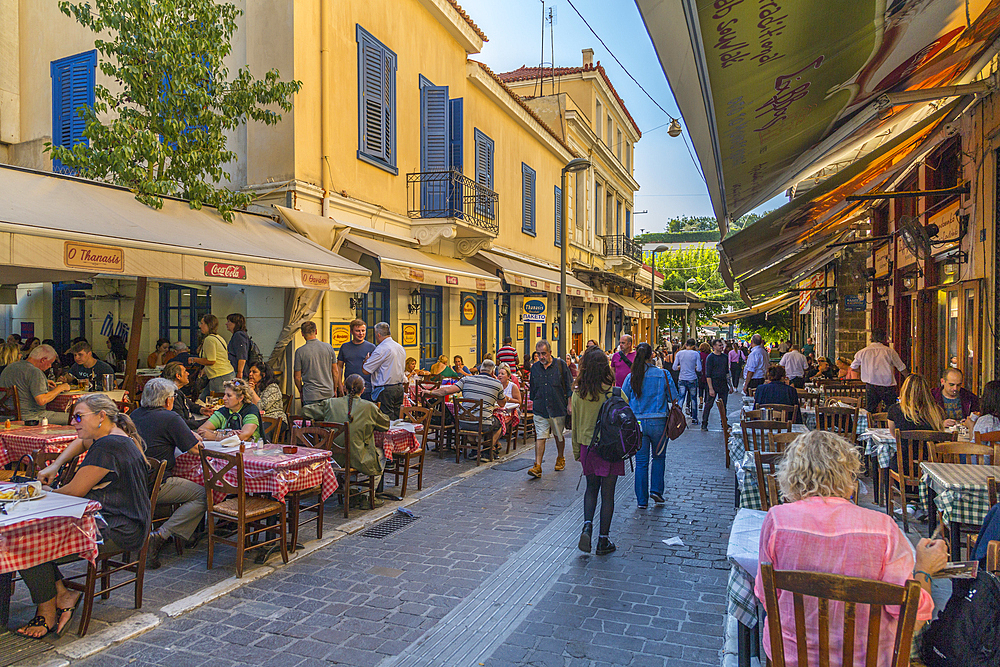 View of restaurants and cafes on Mitropleos during late afternoon, Athens, Greece, Europe