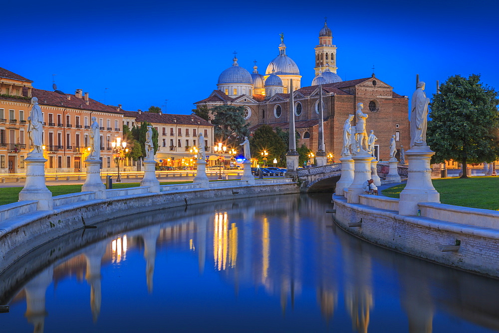 View of statues in Prato della Valle at dusk and Santa Giustina Basilica visible in background, Padua, Veneto, Italy, Europe