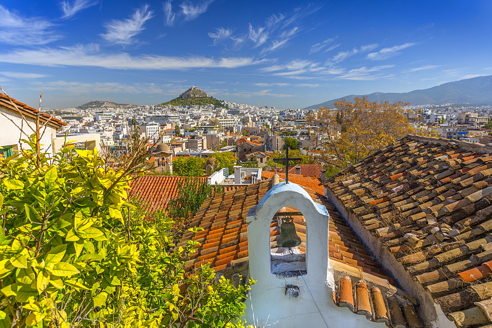 View of Athens and Likavitos Hill over the rooftops of the Plaka District, Athens, Greece, Europe