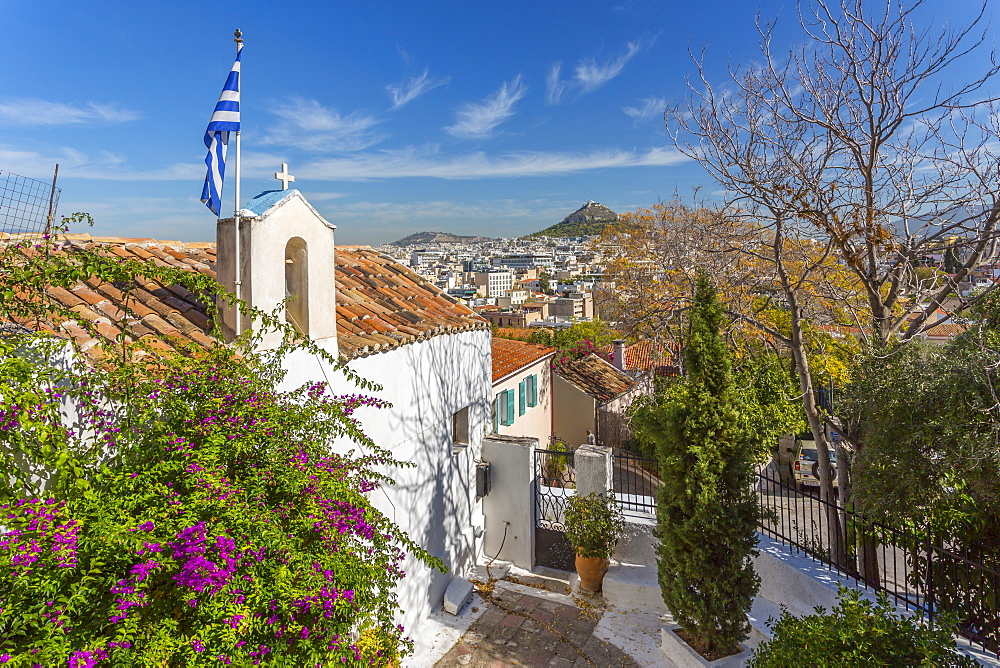 View of Athens and Likavitos Hill over the rooftops of the Plaka District, Athens, Greece, Europe