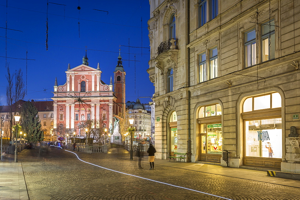 View of Franciscan Church and Triple Bridge at dusk, Ljubljana, Slovenia, Europe