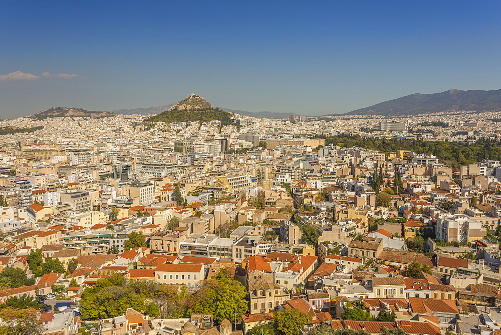 View of Athens and Likavitos Hill over the rooftops of the Plaka District from The Acropolis, Athens, Greece, Europe