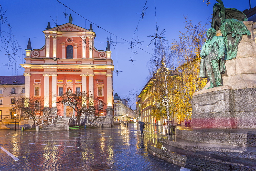 Ornate facade of Franciscan Church of the Annunciation and Preseren Monument in Plaza Presernov at dusk, Ljubljana, Slovenia, Europe