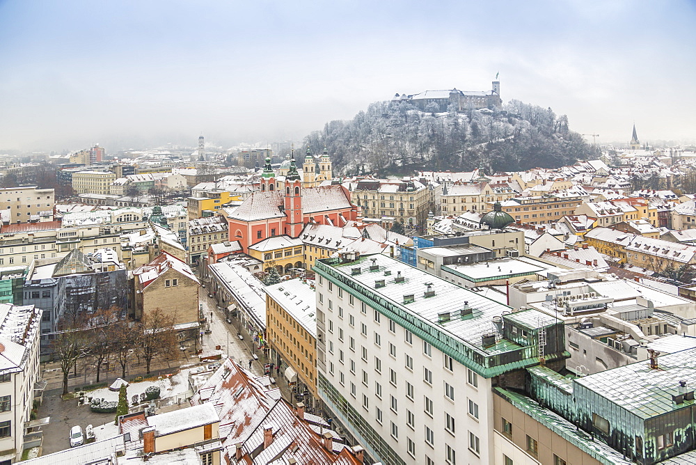 View of snow covered Ljubljana old town and Castle from The Skyscraper, Ljubljana, Slovenia, Europe