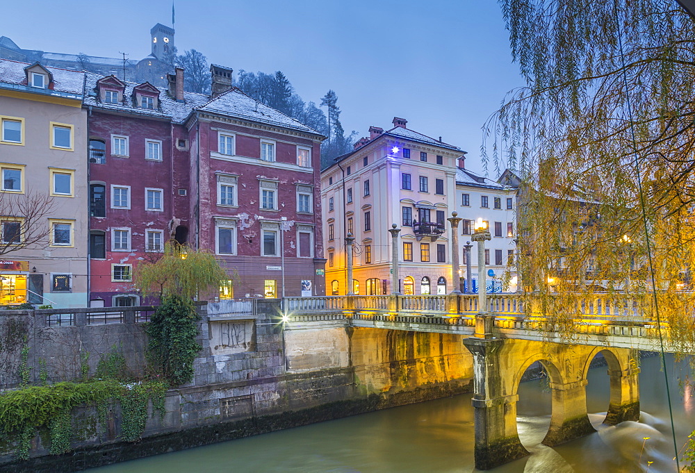 View of Cobblers Bridge and Ljubljana Castle at dusk, Ljubljana, Slovenia, Europe