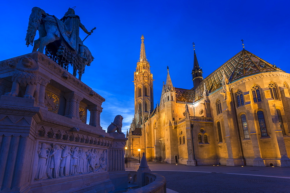 Statue of King Stephen I and Matthias Church at dusk, Fishermans Bastion, Budapest, Hungary, Europe