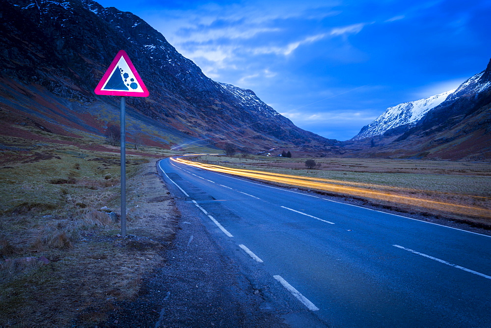 View of road through the Glencoe Valley at dusk, Glencoe, Highland Region, Scotland, United Kingdom, Europe