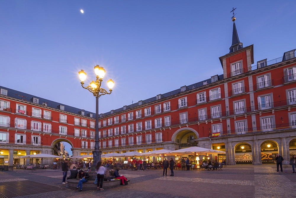 View of restaurants in Plaza Mayor at dusk, Madrid, Spain, Europe