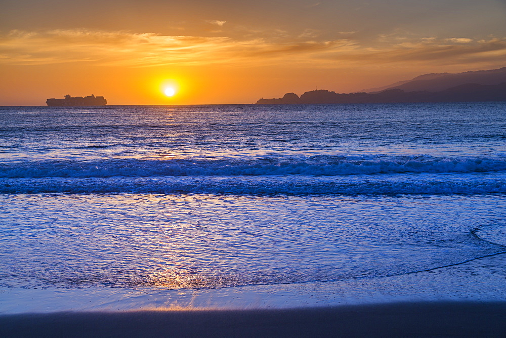 Sunset from Baker Beach overlooking Pacific Ocean at dusk, South Bay, San Francisco, California, United States of America, North America