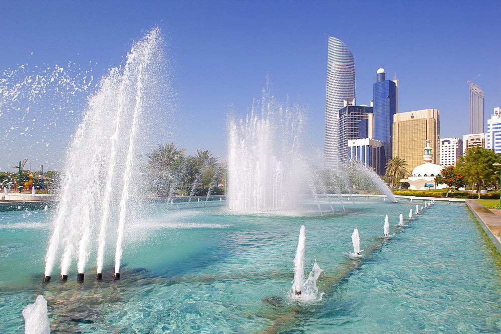 Contemporary architecture and Al Markaziyah Gardens and Fountain, Abu Dhabi, United Arab Emirates, Middle East