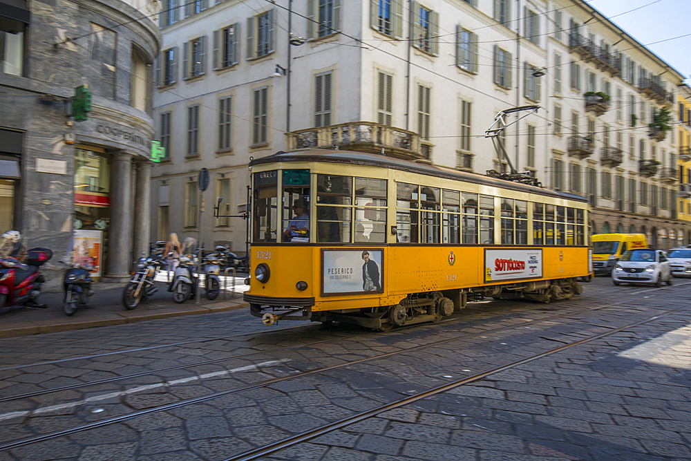 City tram passing on Via Alessandro Manzoni, Milan, Lombardy, Italy, Europe