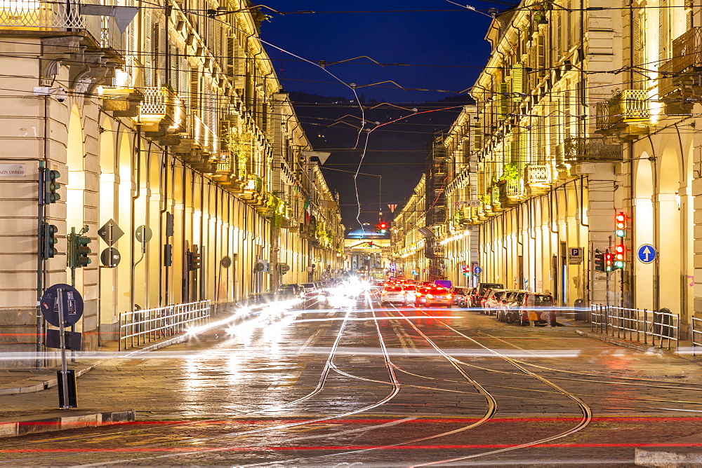 View of Via Roma and Porta Nuova Railway Station at night, Turin, Piedmont, Italy, Europe