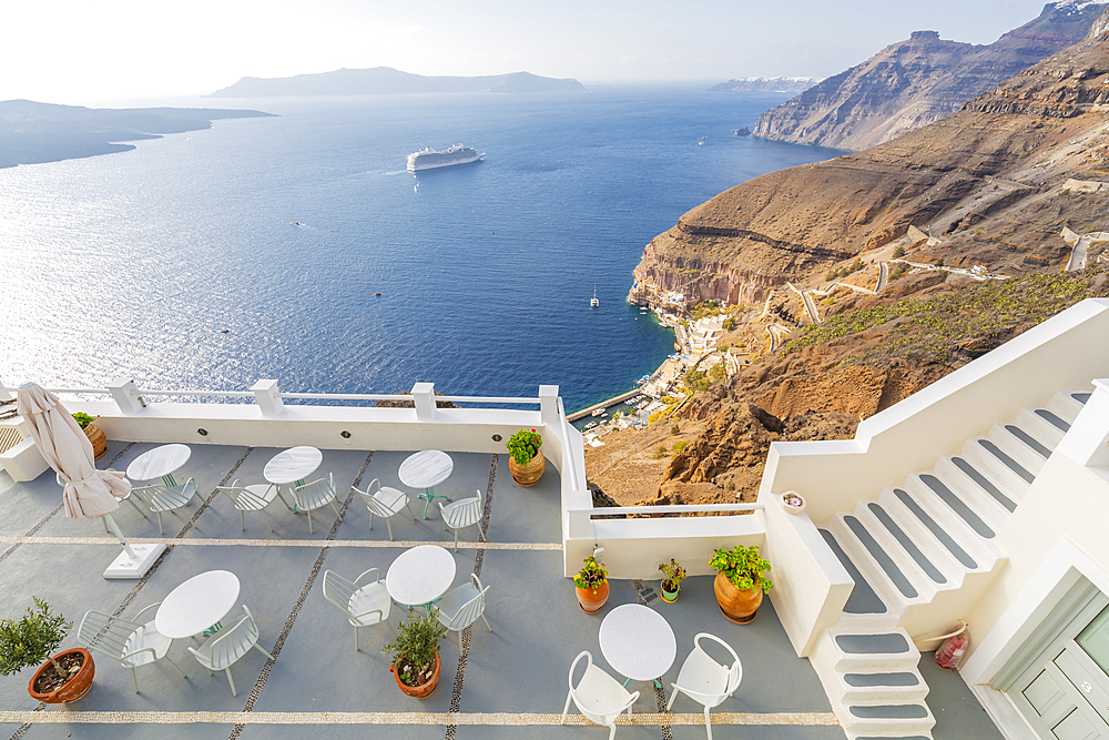 View of Fira white washed houses, harbour and cruise ship, Firostefani, Santorini (Thira), Cyclades Islands, Greek Islands, Greece, Europe