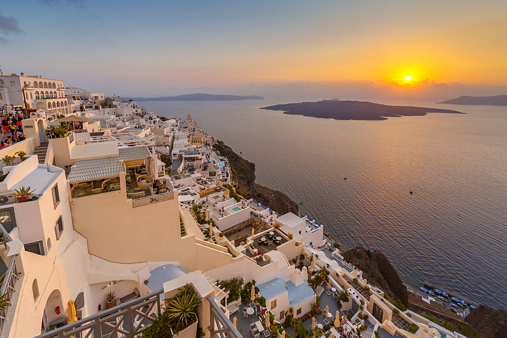 View of white washed houses and Mediterranean sea at sunset, Fira, Firostefani, Santorini (Thira), Cyclades Islands, Greek Islands, Greece, Europe