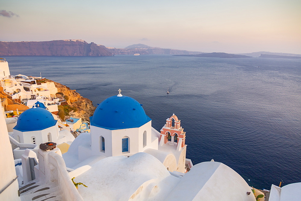 View of blue domes of churches in Oia village, Santorini, Cyclades, Aegean Islands, Greek Islands, Greece, Europe