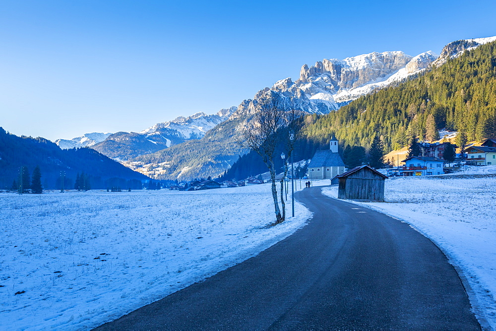 Road through snow under Dolomites Italy, Europe