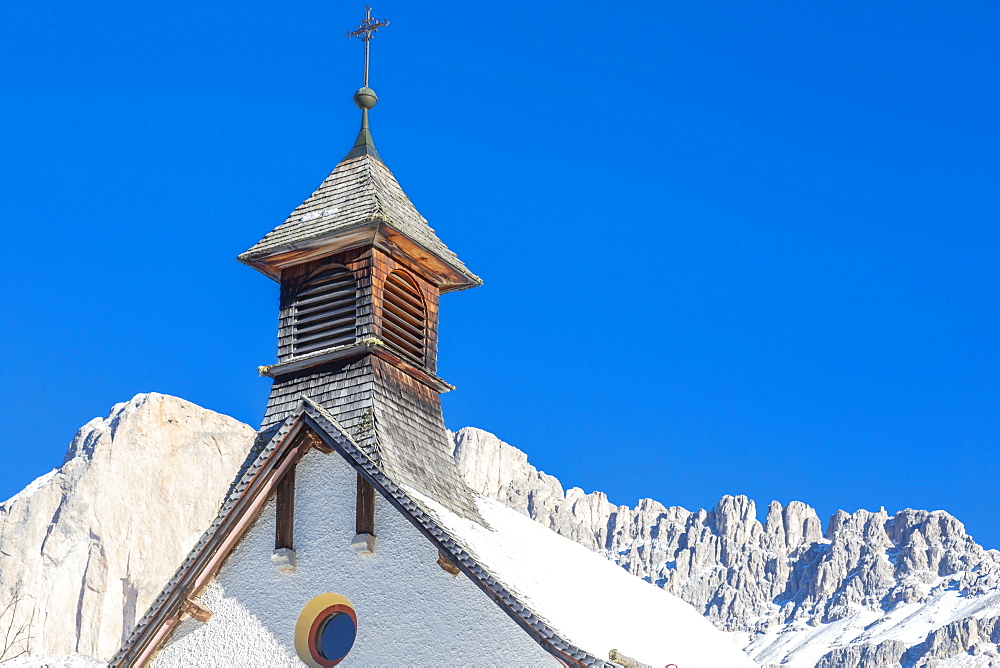 Church by mountains in Carezza, Italy, Europe