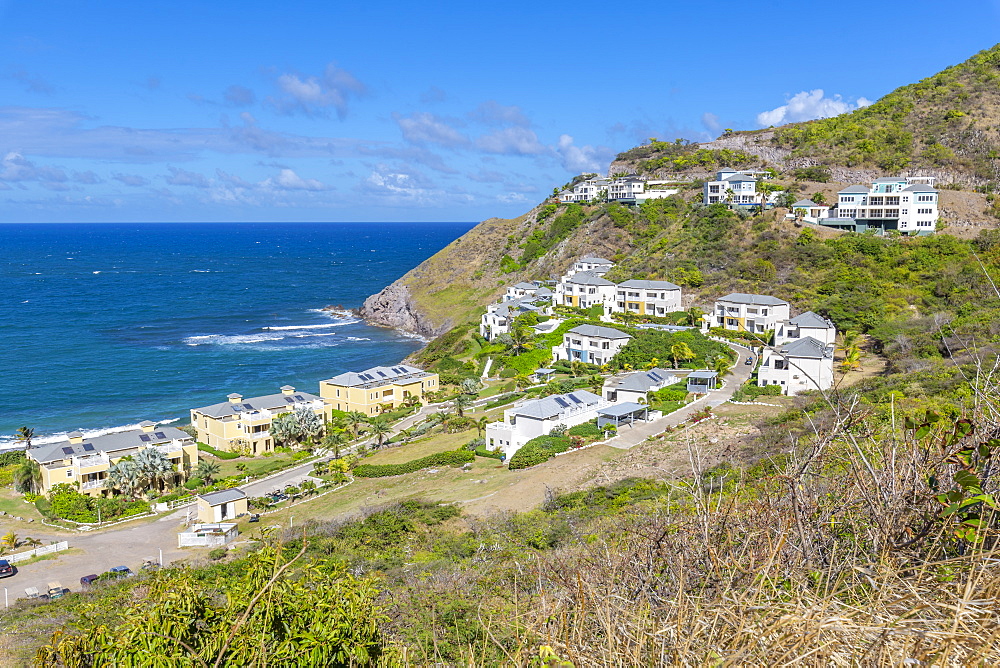 View of Kittian Village and Caribbean Sea, St. Kitts and Nevis, West Indies, Caribbean, Central America