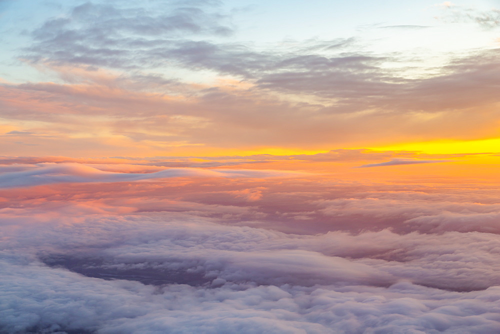 Generic view from airplane window of sunrise over England, United Kingdom, Europe