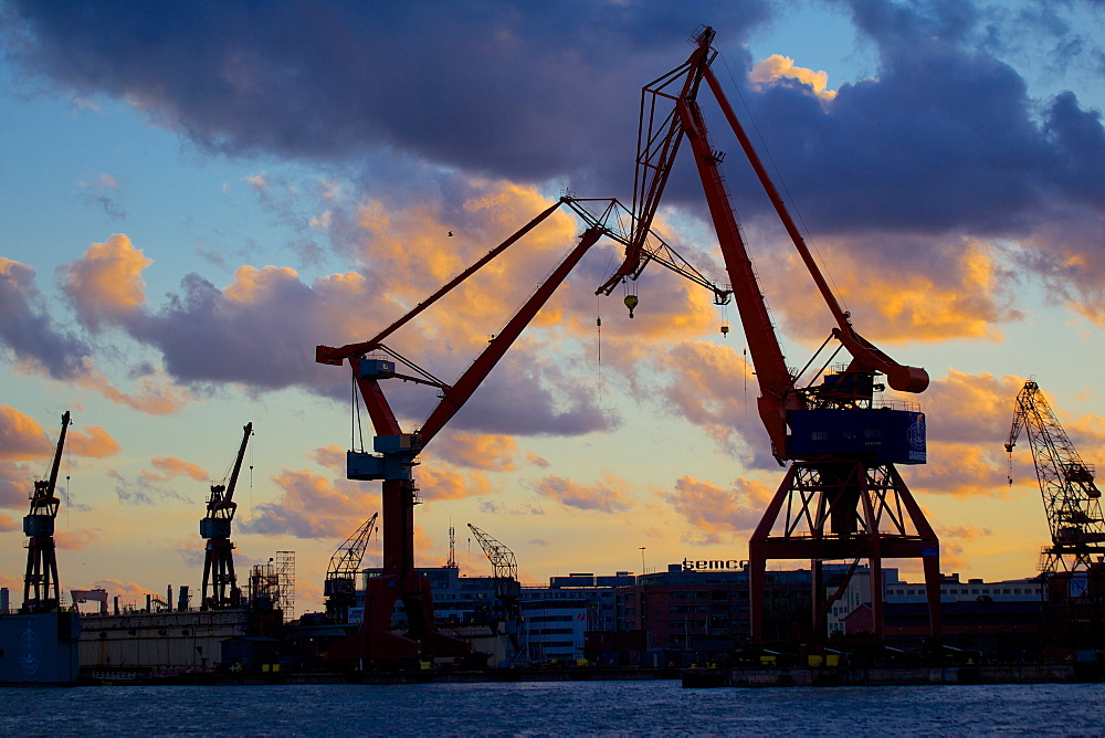 Dockyard cranes at sunset, Gothenburg, Sweden, Scandinavia, Europe