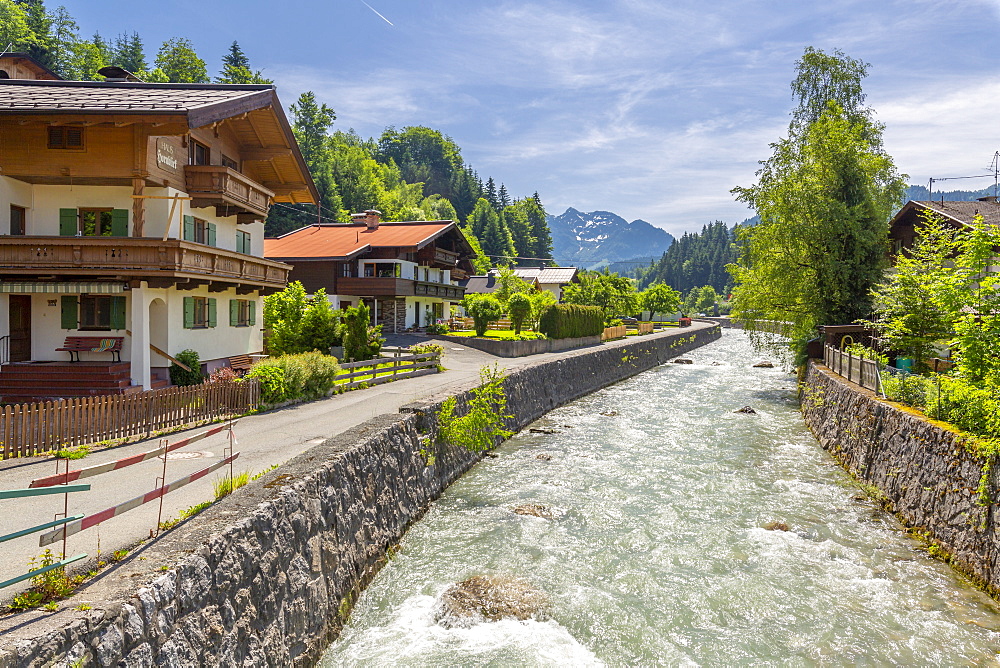 View of river through Fieberbrunn, Fieberbrunn, Austrian Alps, Tyrol, Austria, Europe