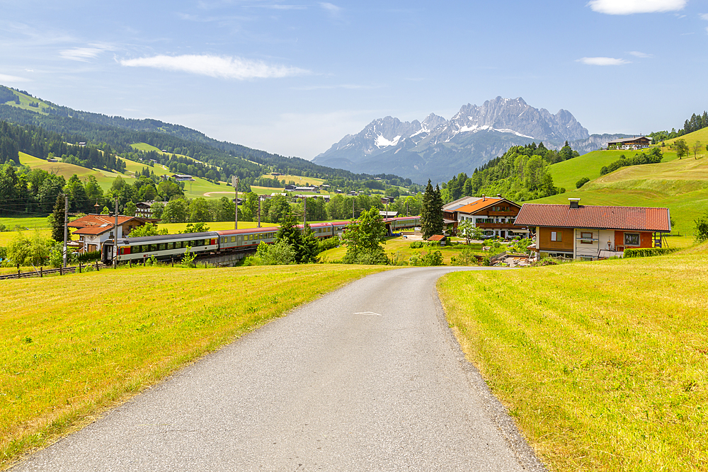 View of trainline and Ellmauer Halt Mountain peak near St. Johann, Austrian Alps, Tyrol, Austria, Europe