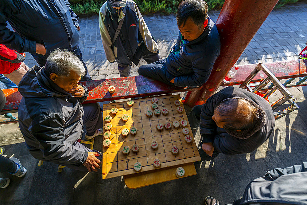 Locals playing board game in Gathering at the Ghost Corridor in the Temple of Heaven, Beijing, People's Republic of China, Asia