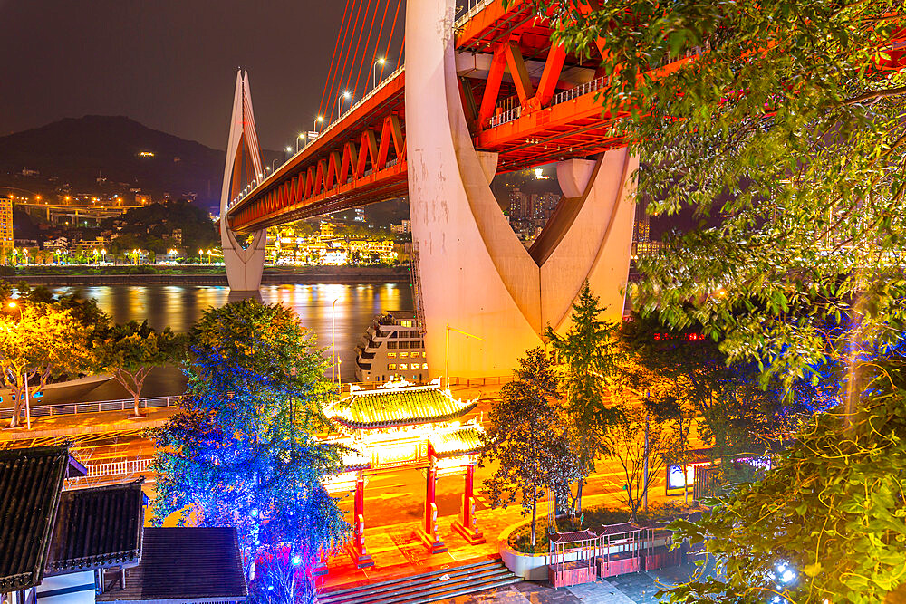 View of Masangxi Bridge and buildings near Arhat Buddhist Temple at dusk, Yuzhong District, Chongqing, China, Asia