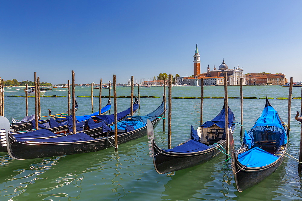 View of gondolas and San Giorgio Maggiore and Lido, Venice, UNESCO World Heritage Site, Veneto, Italy, Europe