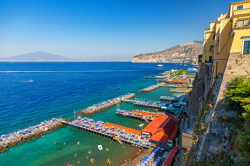 View of Leonelli's beach, public beach and Mount Vesuvius, Sorrento, Campania, Italy, Europe