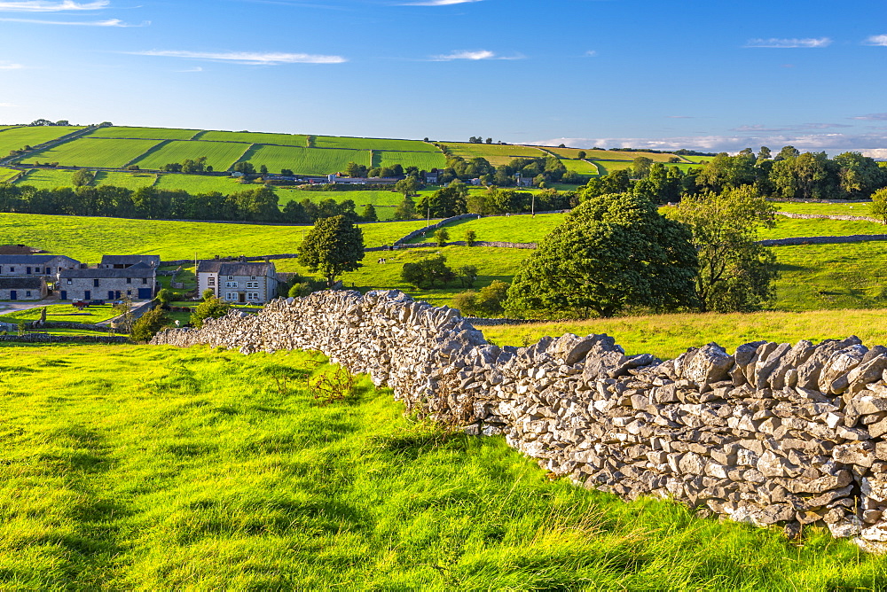 View of dry stone walls and Over Haddon village, Peak District National Park, Derbyshire, England, United Kingdom, Europe