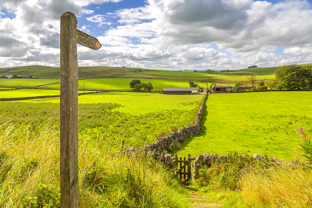 View of footpath sign and farmland, Tissington, Peak District National Park, Derbyshire, England, United Kingdom, Europe