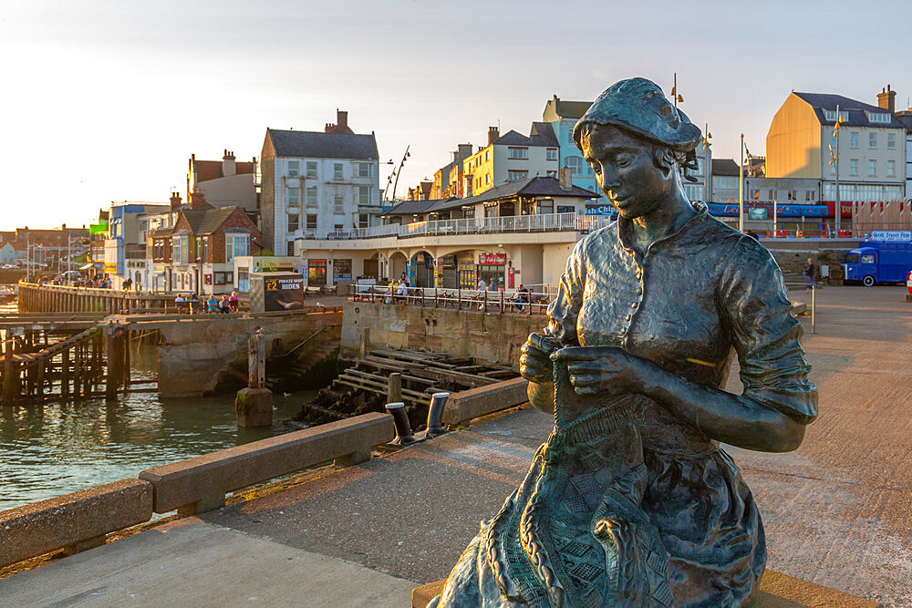 View of the Gansey Girl statue and harbour at sunset, Bridlington, East Yorkshire, England, United Kingdom, Europe