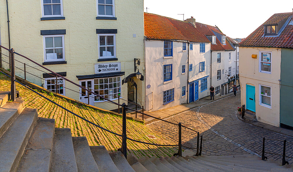 View of cobbled street and Whitby from 199 steps leading to St. Mary's Church, Whitby, Yorkshire, England, United Kingdom, Europe