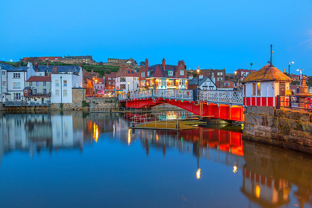 View of Whitby Bridge and reflections on River Esk at dusk, Whitby, Yorkshire, England, United Kingdom, Europe