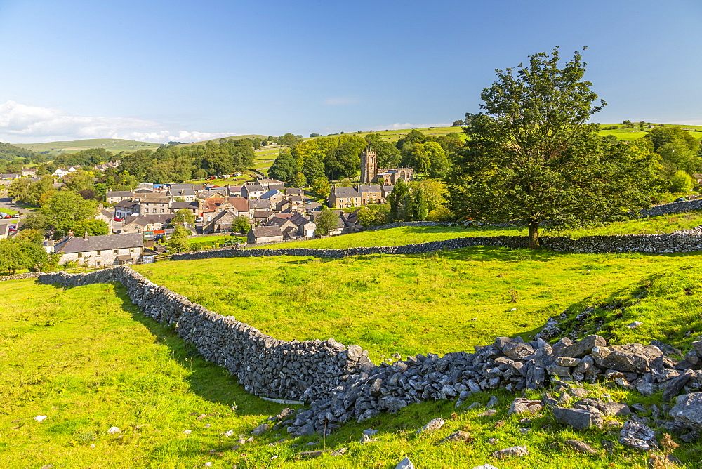 View of village church, cottages and dry stone walls, Hartington, Peak District National Park, Derbyshire, England, United Kingdom, Europe