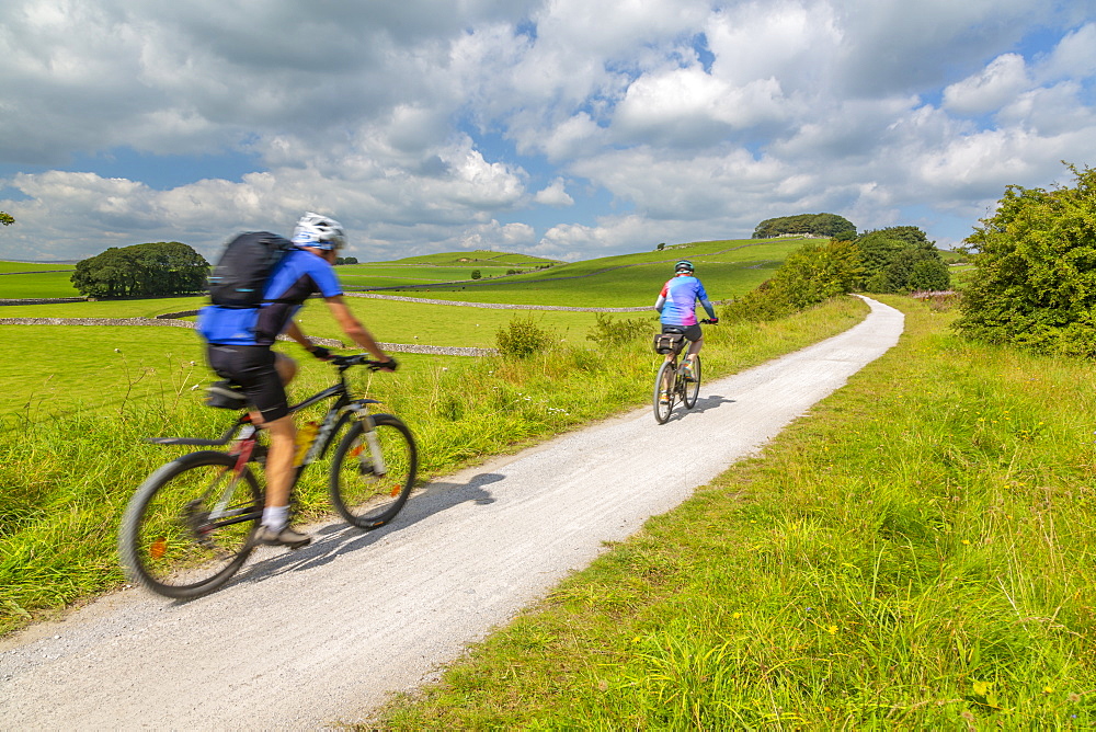 View of cyclist on the Tissington Trail, Tissington, Peak District National Park, Derbyshire, England, United Kingdom, Europe