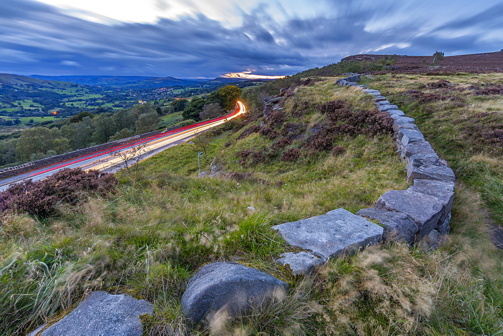 View traillights toward Hathersage from Lawrencefield during autumn, Hathersage, Hope Valley, Derbyshire Peak District, Derbyshire, England, United Kingdom, Europe