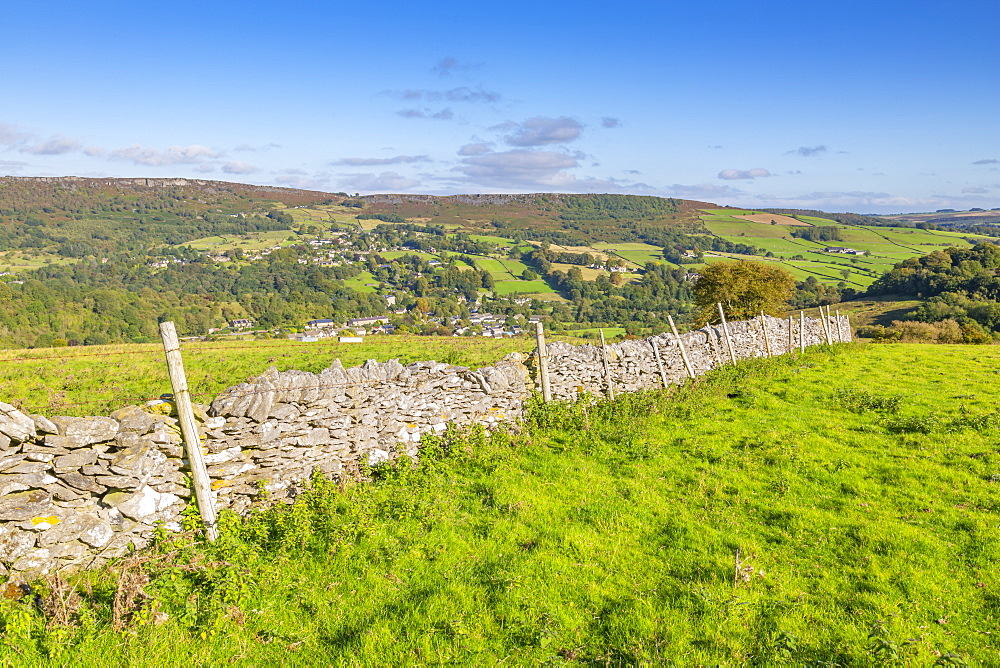 View of dry stone wall and Calver Village overlooked by Curbar Edge, Calver, Derbyshire Peak District, Derbyshire, England, United Kingdom, Europe